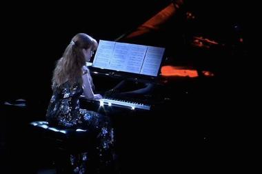 Sarah Cahill playing piano.