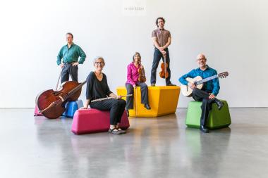 Left Coast Chamber Ensemble Musicians, in order: Michel Taddei, Stacey Pelinka, Phyllis Kamrin, Kurt Rohde, Michael Goldberg, in order on colorful blocks against a gray neutral background