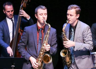 Twin brothers Peter and Will Anderson play the saxophone.
