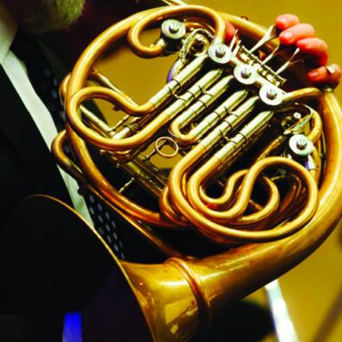 close-up of French horn in an orchestra