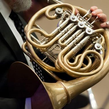Close-up of french horn in an orchestra