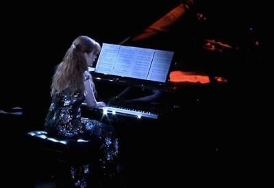 Sarah Cahill playing piano.