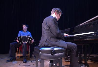 Left: bandoneon player, seated; right: piano player at piano
