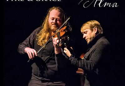 A tall man playing violin next to a shorter man playing guitar