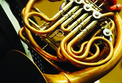 close-up of French horn in an orchestra