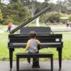 Young boy plays Flower Piano | <em>Credit: Natalie Jenks</em>