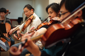 Faculty members of the two conservatories rehearse Mendelssohn's Octet 