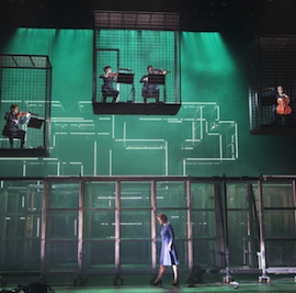 ENO's <em>Fidelio</em> with Emma Bell and the Heath Quartet suspended in cages Photo by Tristram Kenton