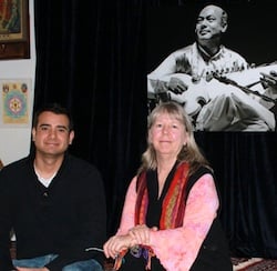 Alam Khan and Mary Khan beneath a portrait of the founder of the Ali Akbar College of Music in San Rafel Photo by Jeff Kaliss