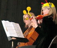  Susan Sigge, flute; Elizabeth Vandervennet, cello; and Kerry Borgen, violin