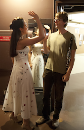 Alexandra Silber (Maria) and clarinetist Carey Bell high-fiving backstage