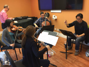 Castillo (right) conducting at a recording session of his new CD