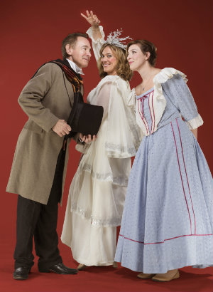 Scrooge (Jason Graae) is reunited with Belle (Melissa Reinertson), on the right, by the Ghost of Christmas Past (Elise Youssef). (Photo by David Allen)