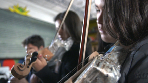 Musicians from the Youth Orchestra of Cateura, Paraguay, performing with instruments made from recyclable materials.