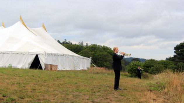 Principal trumpeter Scott Macomber warms up outside the Tent Concert Hall at the Mendocino Music Festival. (Photo by Jeff Kaliss)