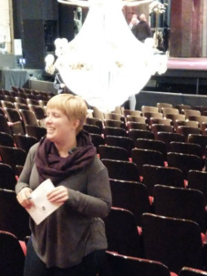 Phantom stage manager Heather Chockley shows off the chandelier (Photos by Janos Gereben) 